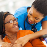 elderly woman and her caregiver